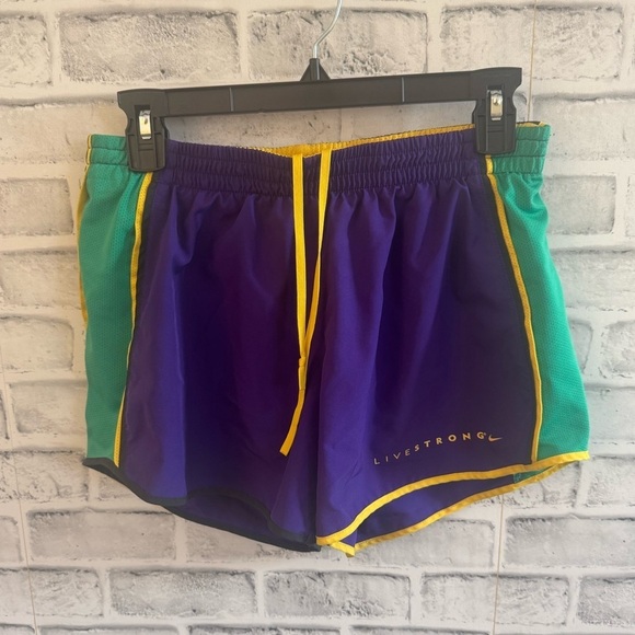 Nike Pants - Women’s Dri-fit Nike Livestrong lined athletic shorts purple/green/yellow Small